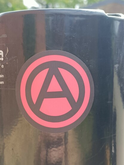 Sticker with the anarchist symbol