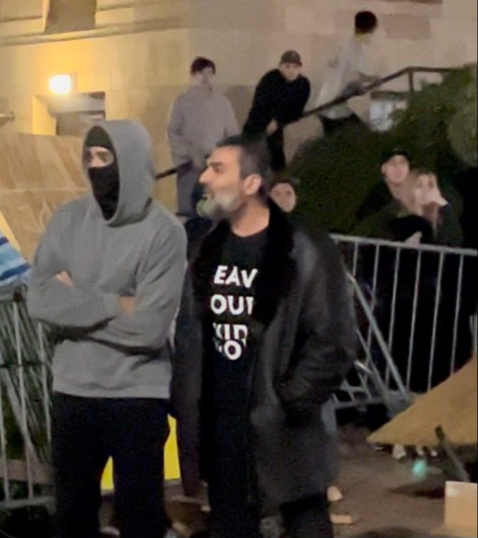 Narek Palyan at UCLA standing next to pro-Israel counter-protesters.