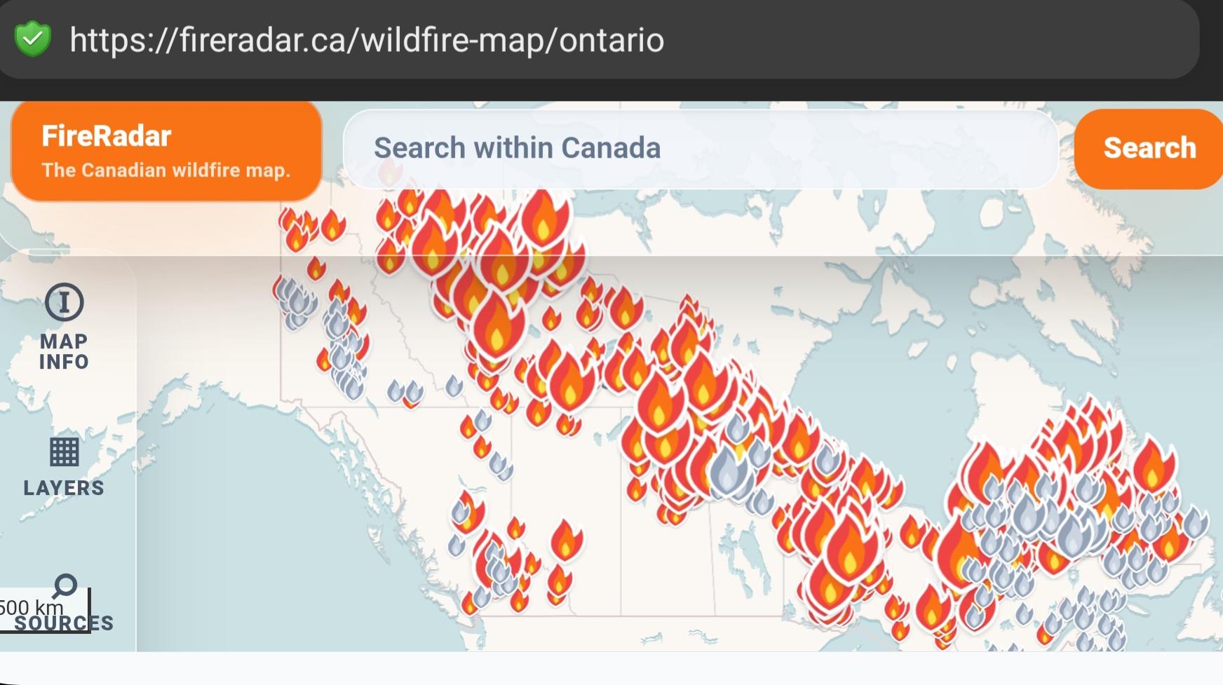 cropped screenshot showing a map of canada covered in flames.