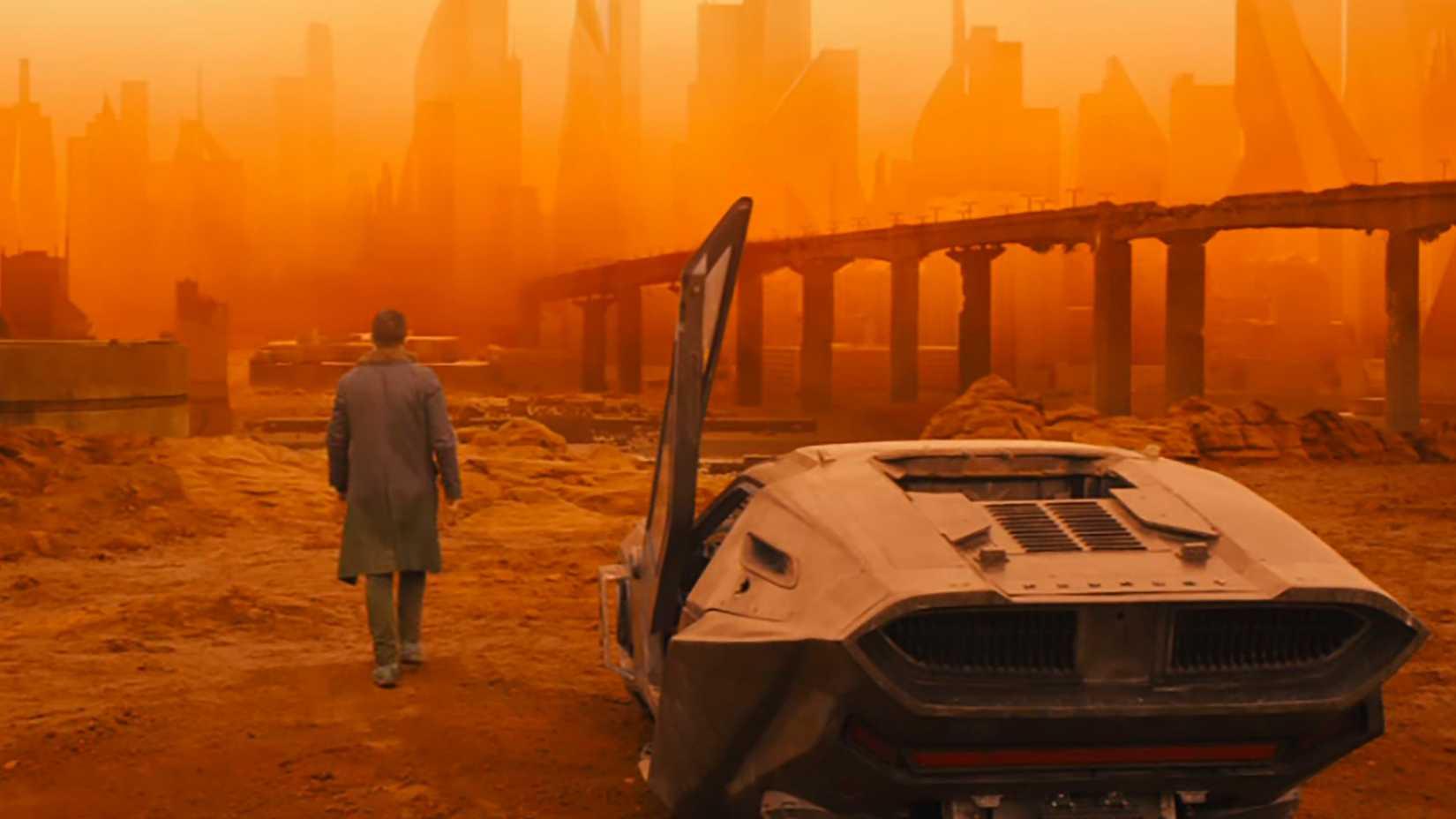 Movie still image:

a figure in a dark trenchcoat is stepping along  an  industrial  roadway, toward a hazy orange  urban skyline, silhouetted against a brighter yellow sky, an̈d away from a sleek fururistic hovercar in the foreground, with its closest door still open, vertically. 

In the distance is an elevated bridge, leading toward the city. 

The entire scene is saturated with a brownish-orange hazy dust.