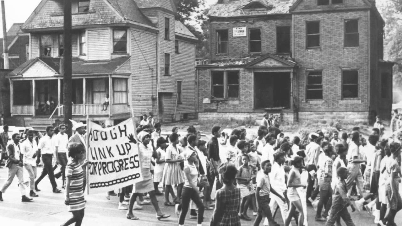 Image of African American protesters marching through the Hough neighborhood of Cleveland