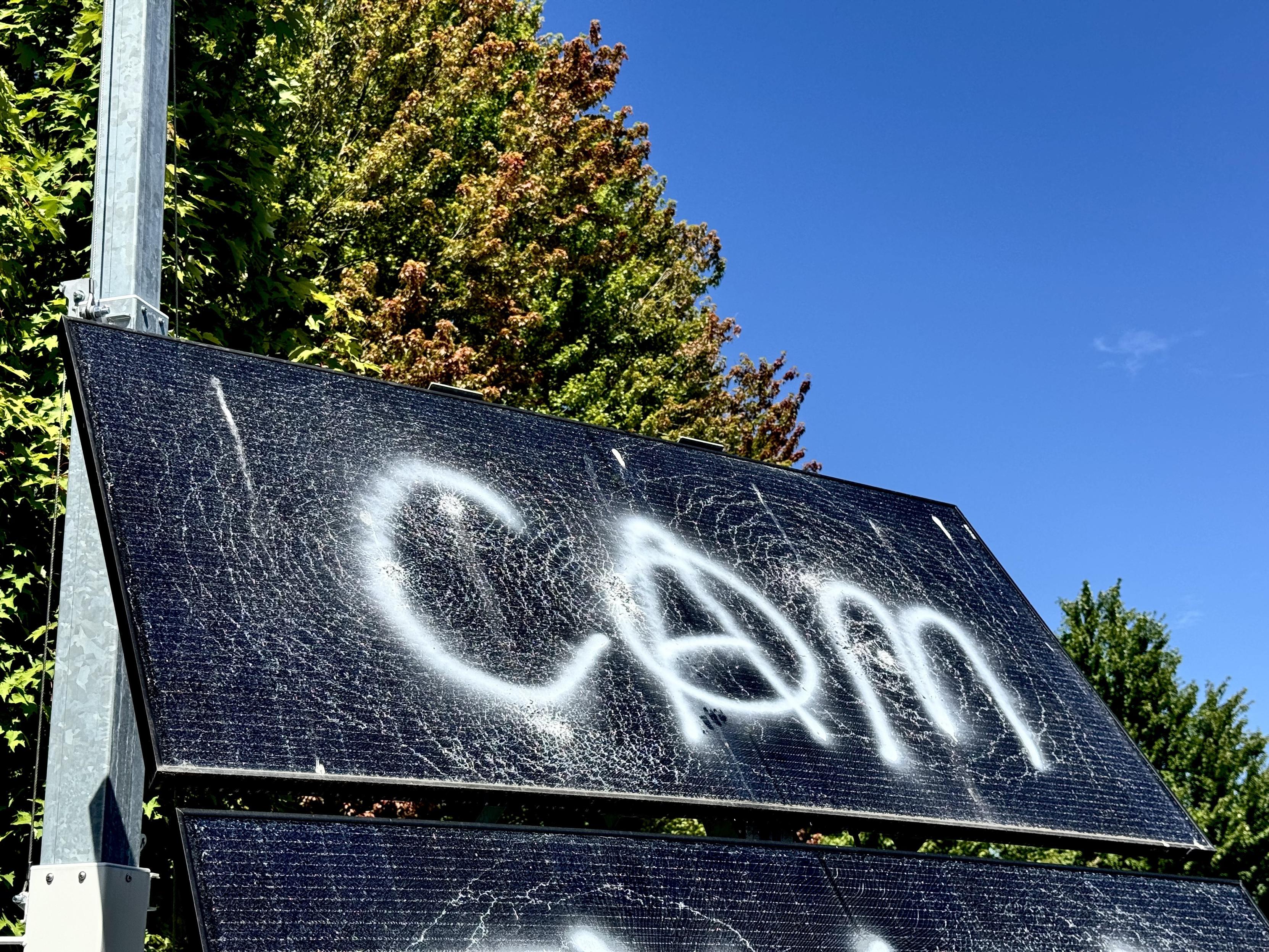 Surveillance solar panel smashed and tagged with “cam”