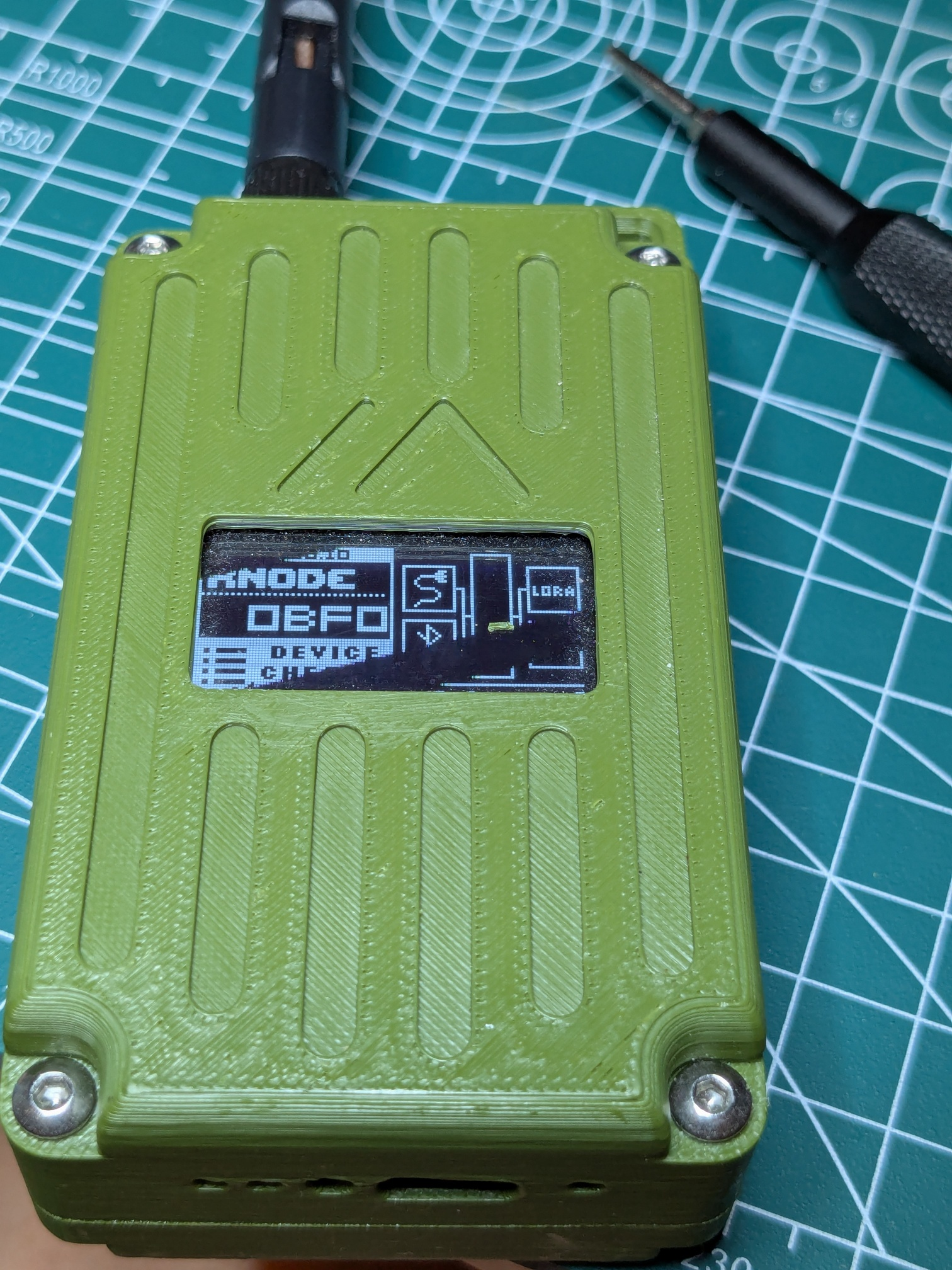 A photo of a green RAK Wireless WisMesh Pocket v2 LoRa radio